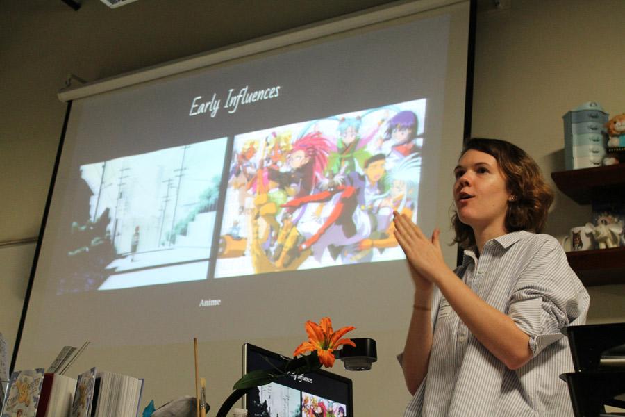 Smiling, Rebecca Mock shows students her influences early in her career. She gave students ideas on how to develop their own individual styles as artists, and how to work past any obstacles. “She kept on telling us to keep trying. Even if you present work to someone who rejects it, eventually someone will take it,” Sydney Williams, eighth grade visual major said.