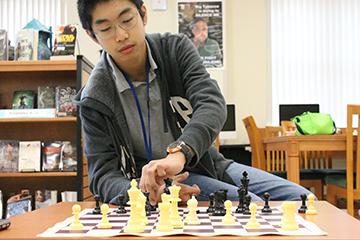 Eighth grader George Zhou snags rank in top 25 chess players of United States
