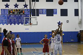 Protecting the paint, Czhen Beneby blocks an Independence Middle opponent. The girls went on to lose the game in overtime, 30-34.