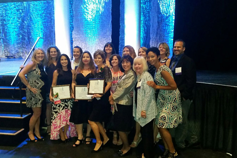 After+receiving+their+awards%2C+Michelle+DeSilva%2C+Jamie+Stamile%2C+and+Shannon+Owens+pose+for+a+picture+along+with+other+teachers+from+Bak.+The+Dwyer+Award+is+a+prestigious+award+for+teachers+that+recognizes+their+excellence+in+education.+