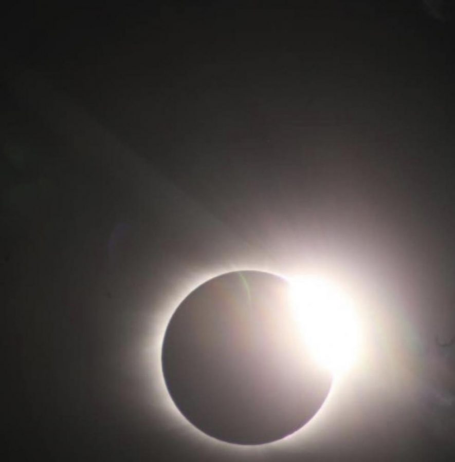 With eyes focusing on the eclipse, the moon slightly move, creating a diamond ring. A diamond ring effect, or the Bailey’s Beads effect, was when the moon’s craters allowed some sunlight to shine in through some places. 
