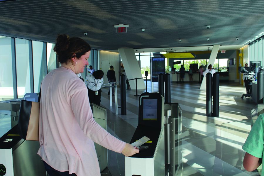 Scanning her ticket, Evelyn Velez enters the Brightline station in Ft. Lauderdale. Brightline launched the week of Jan. 8, opening two stations in South Florida. The stations include a café, waiting lounge, and a luggage check-in.