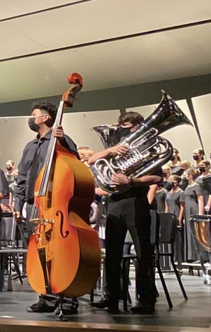 Preparing for the Mixed Music Concert, Yurem Martinez-Munoz and Graham Randolph, eighth grade band majors, wait for directions from the conductor. “Weve been preparing for our Combined Music Dept. concert since Oct. 11,” Nancy Beebe said