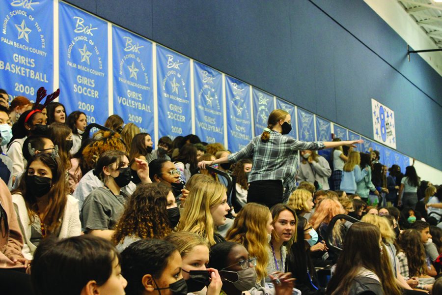 Watching the pep rally, seventh graders cheer on their peers participating in games. “Watching the games from the bleachers was definitely different from actually playing,” Benoit said. This pep rally was the first time in two years where every student was allowed in the gym. 