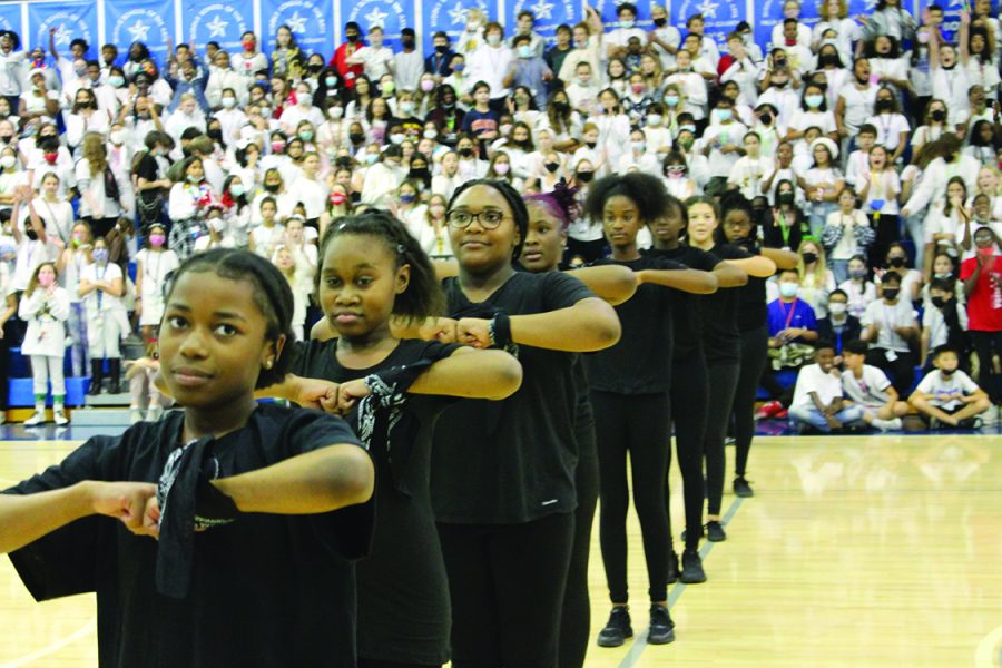 Step Team member Takiyah Henry, eighth grade theater major, performs at the pep rally. There are only four returning members on the team, and there are 28 new members, Shakendra Moorer. Step Team coach, said. Photo by Kya Small-Brush