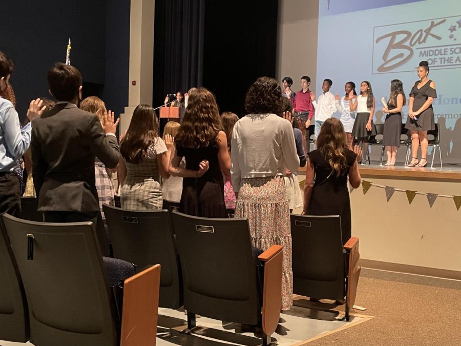 Reciting the NJHS pledge, inductees become official members of the club. “I’m thrilled to be a part of a club that focuses on helping others,” Brenna Epstein said. 