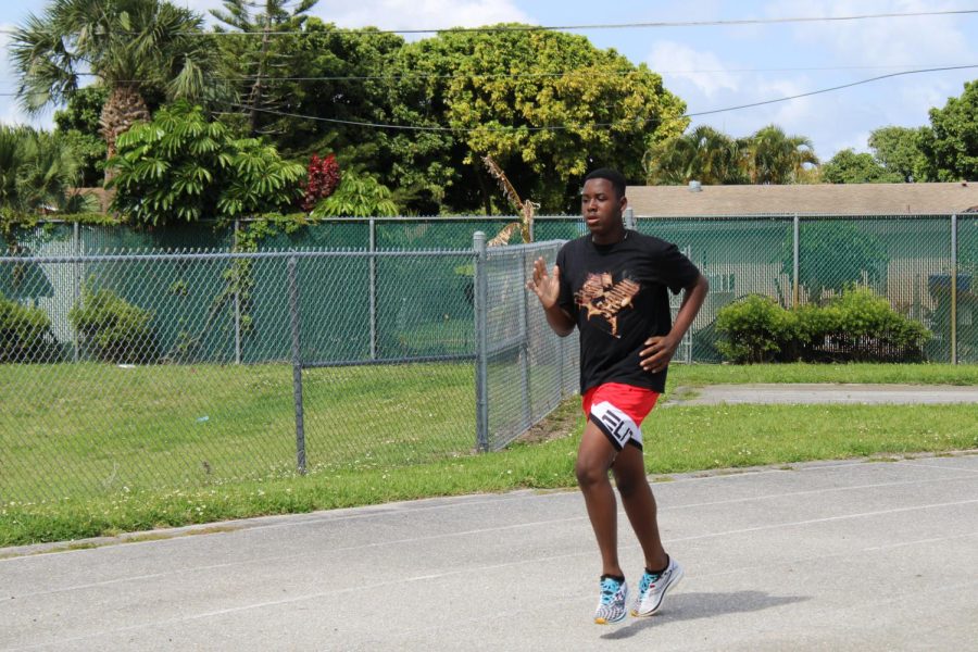 The track and field team members run around the track to prepare for upcoming competitions.  “The constant running is a big challenge because it can become difficult to keep running after a while,”  Carl J. Gibbons II, eighth grade shot put event said. 