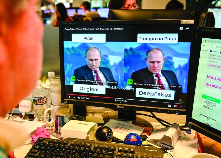 An AFP journalist views a video on January 25, 2019, manipulated with artificial intelligence to potentially deceive viewers, or "deepfake" at his desk in Washington, D.C. (Alexandra Robinson/AFP/Getty Images/TNS)