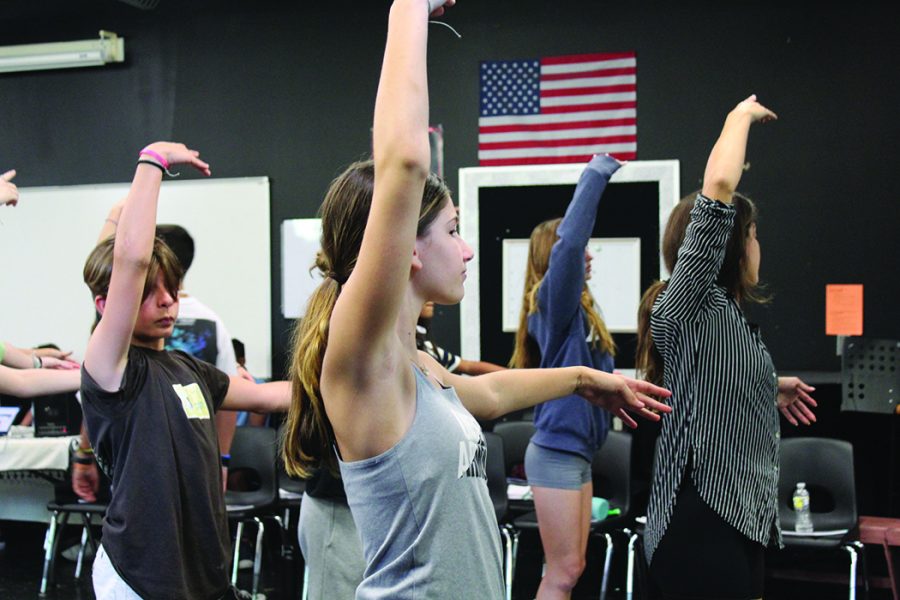 Theater majors follow steps to learn a dance in preparation for their production of “Oklahoma.” Zachary Fischetti, eighth grade theater major, said, “It feels pretty good to be a part of this, and Im really excited, as it incorporates all aspects of musical theater.” Photo by Rotcelyn Caceres 