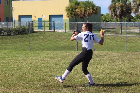 At tryouts, Madelyn Horner warms up by throwing a ball to her partner. “Warming up, stretching, and throwing to each other at the beginning of practice is necessary so you are ready to work and play hard for the entirety of it,” Shah said. Photo by Cole Hoffman
