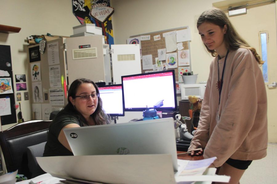2D animation instructor Ashley Monastra helps a student with their project. “Were getting to see that sequence of images and what kind of personality theyre putting into their animation,” Monastra said. Photo by Jaya Ramanujan